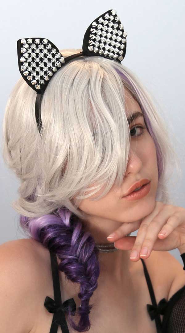Whispers of Desire: Studded Cat Temptation